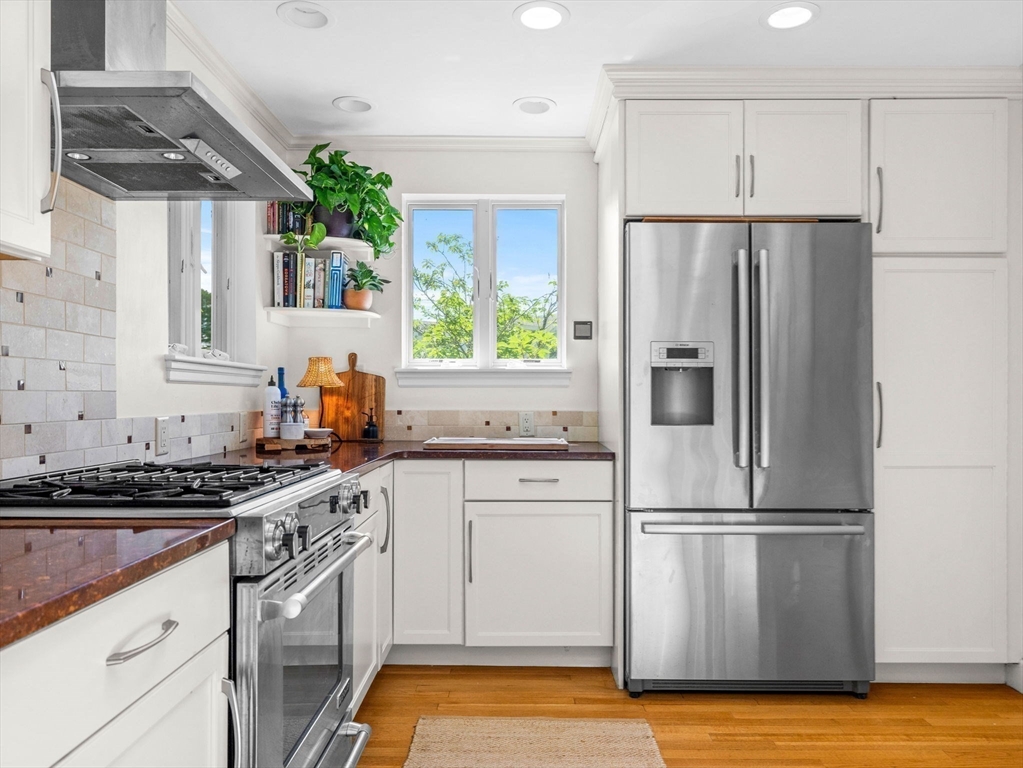 33 Pond Circle Boston, MA 02130 - Photo 9 of 22 a kitchen with granite countertop a refrigerator stove and sink