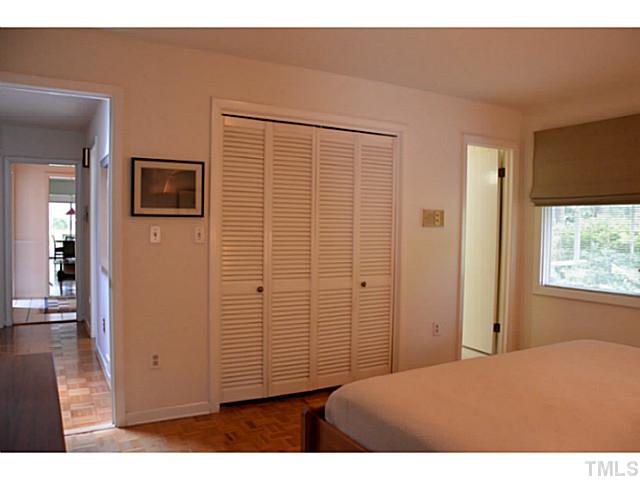 3700 Swann Street Raleigh, NC 27612 - Photo 11 of 20 Master bedroom with private bath is located at the end of the hall on the front of the house.