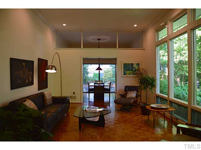 3700 Swann Street Raleigh, NC 27612 - Photo 3 of 20 Soaring 11 foot ceilings welcome natural light through floor to ceiling windows.