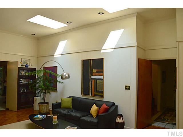 3700 Swann Street Raleigh, NC 27612 - Photo 5 of 20 Two skylights in the den create interesting light throughout the day.