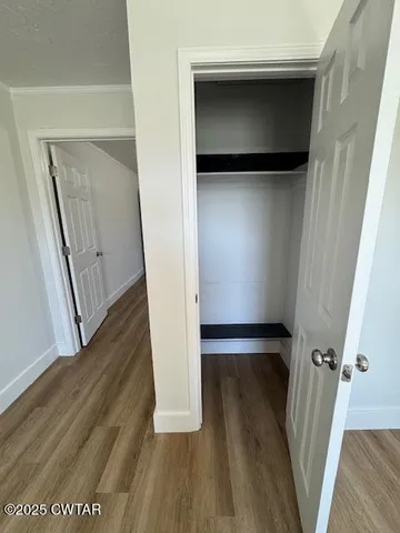 a view of front door with wooden floor