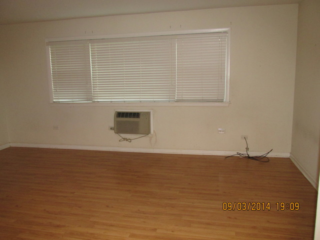 8808 45th Place, Unit 2 Brookfield, IL 60513 - Photo 2 of 10 a view of an empty room with wooden floor