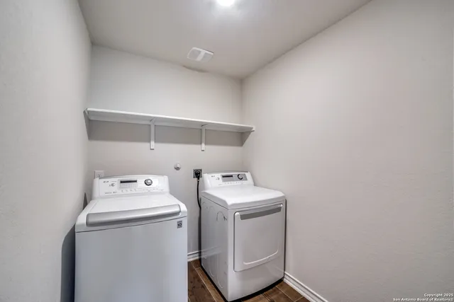 a utility room with dryer and washer