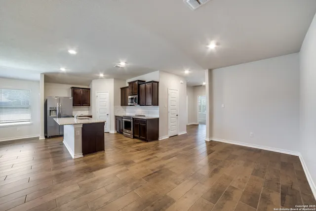 a view of kitchen with microwave oven stove and oven