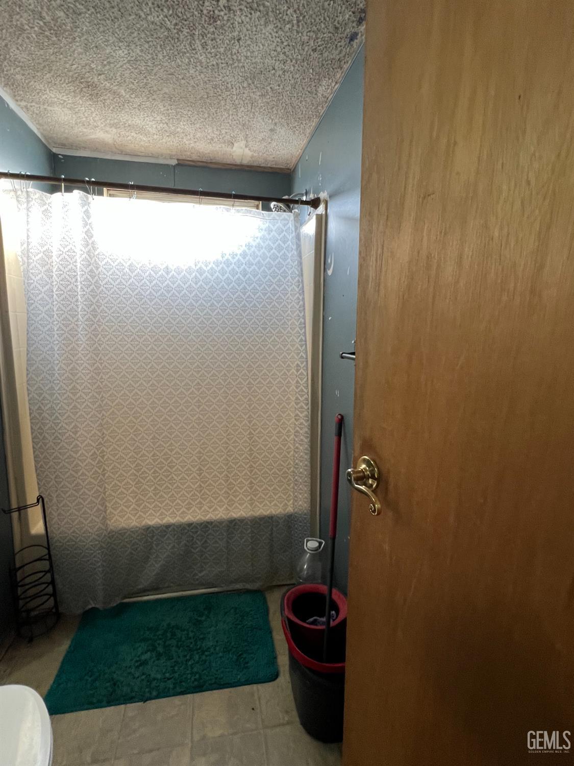 Undisclosed Address Bakersfield, CA 93309 - Photo 8 of 14 a bathroom with a shower and a sink