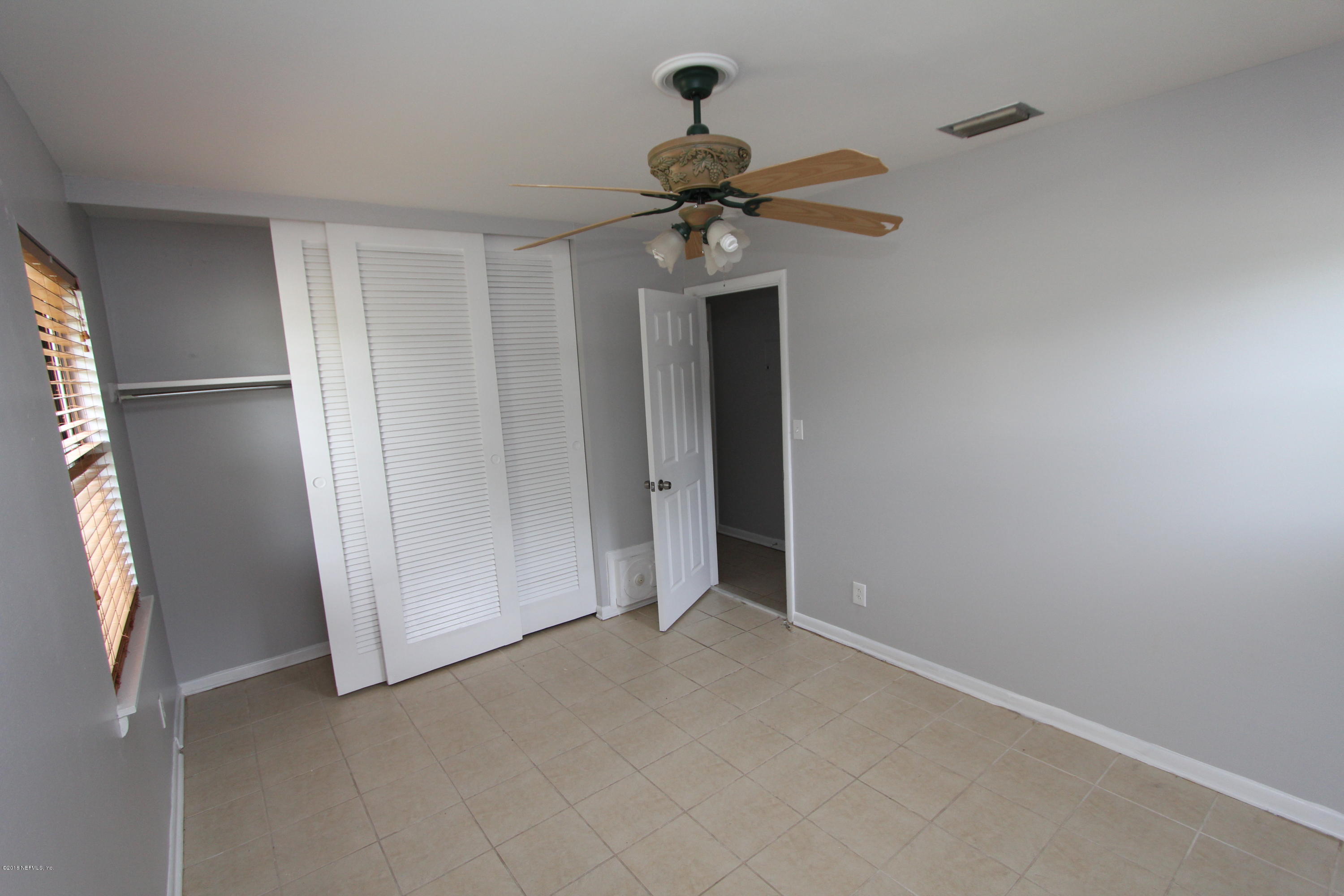 10610 Dodd Road Jacksonville, FL 32218 - Photo 14 of 24 a view of a chandelier fan in a room