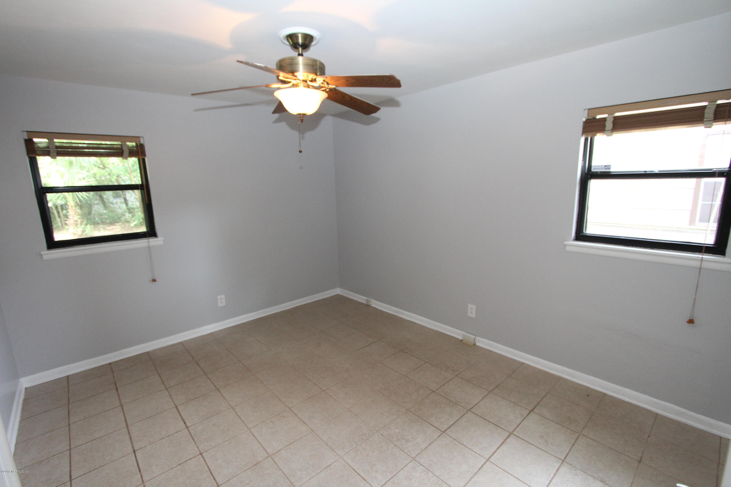 10610 Dodd Road Jacksonville, FL 32218 - Photo 15 of 24 an empty room with a window