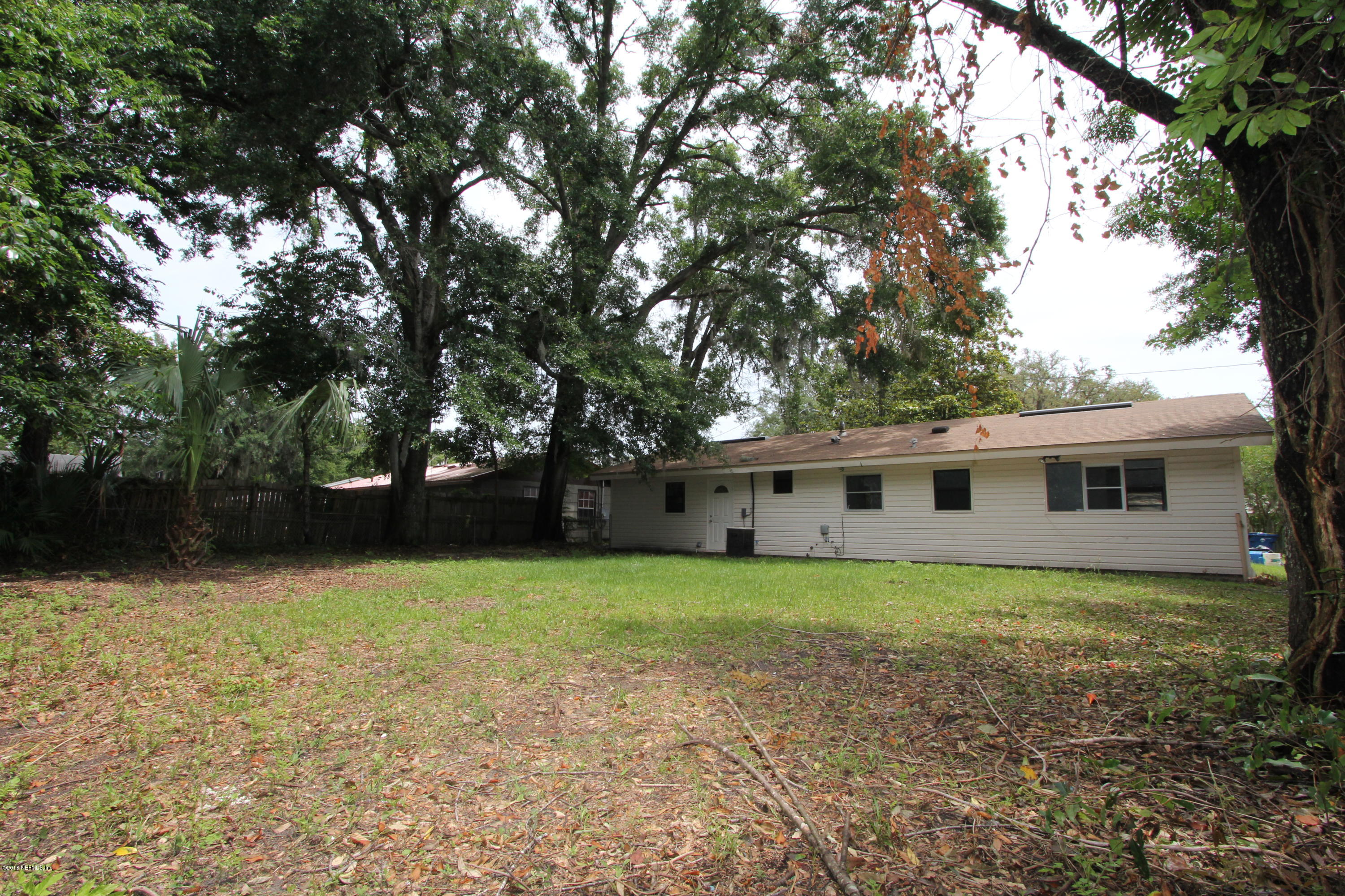 10610 Dodd Road Jacksonville, FL 32218 - Photo 18 of 24 a view of a house with a backyard