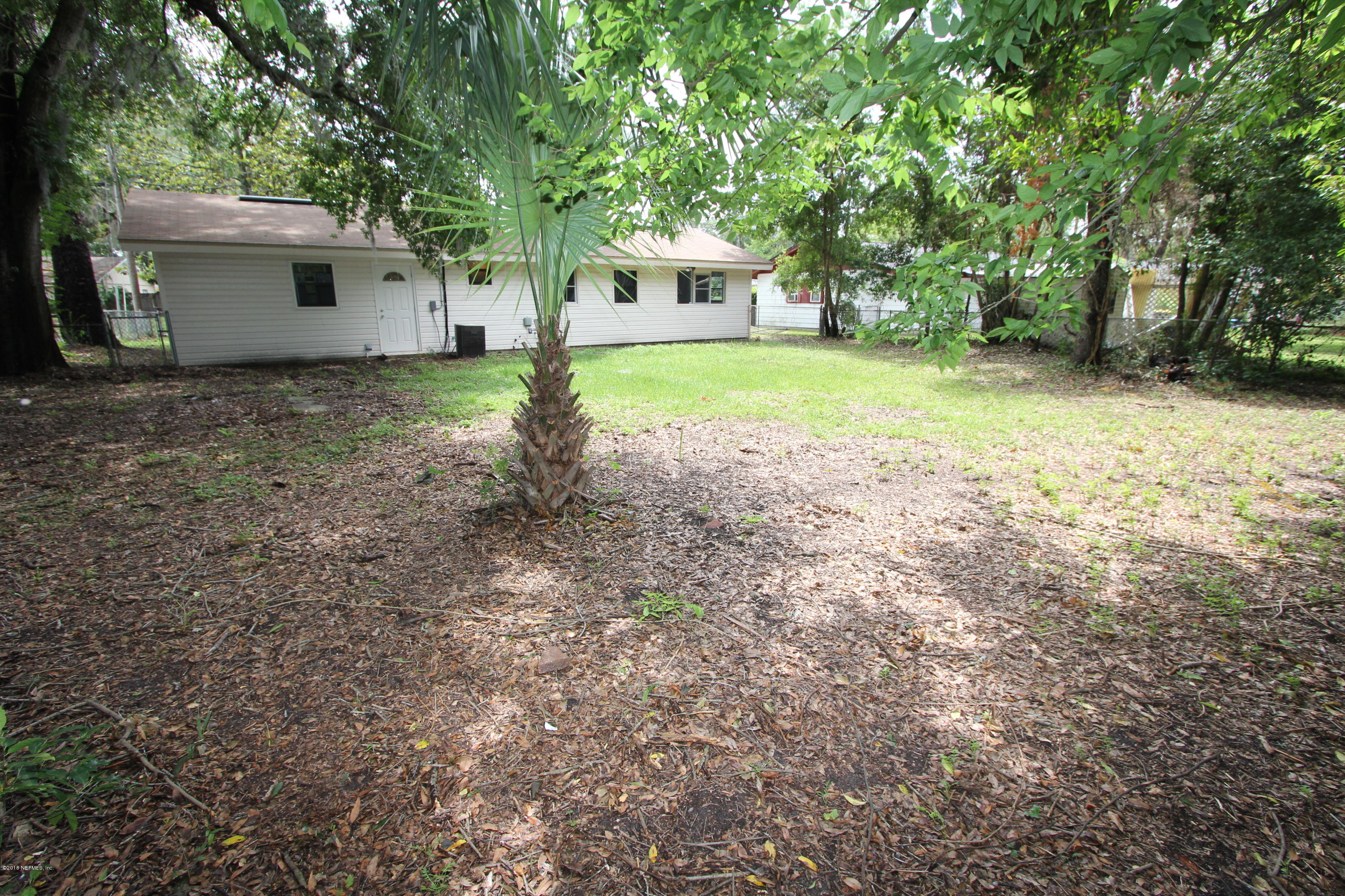 10610 Dodd Road Jacksonville, FL 32218 - Photo 19 of 24 a front view of house with yard and green space
