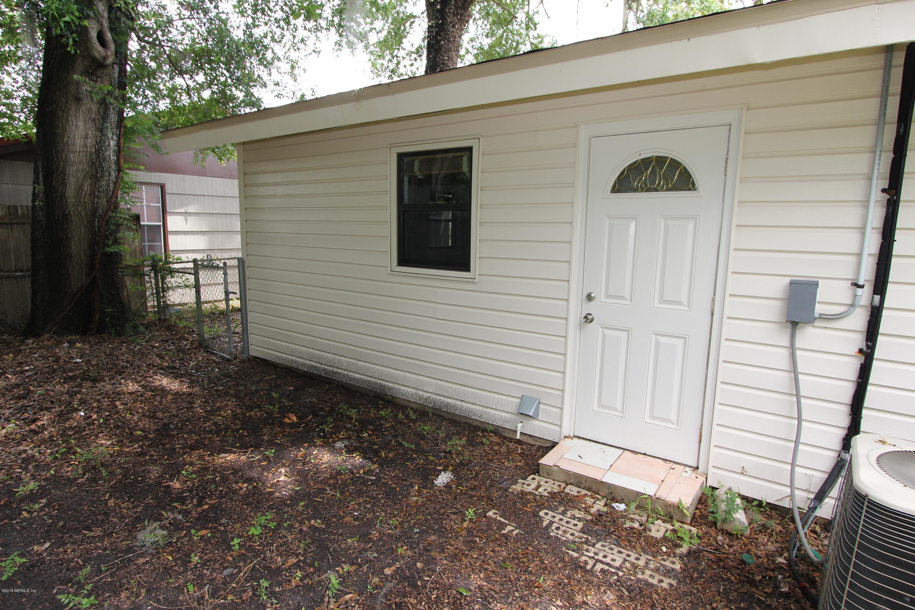 10610 Dodd Road Jacksonville, FL 32218 - Photo 20 of 24 a view of a house with a yard