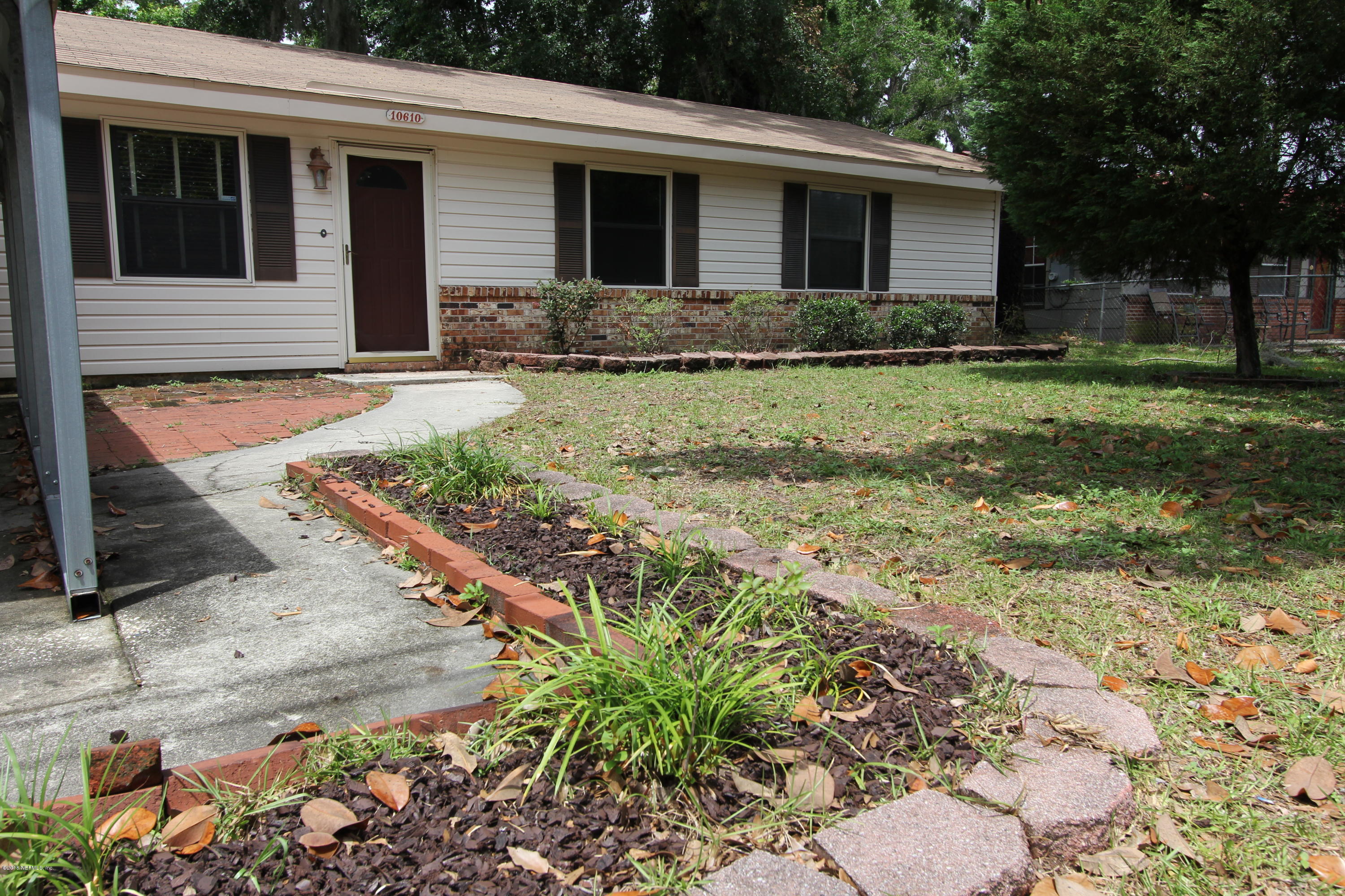 10610 Dodd Road Jacksonville, FL 32218 - Photo 2 of 24 a front view of a house with a yard
