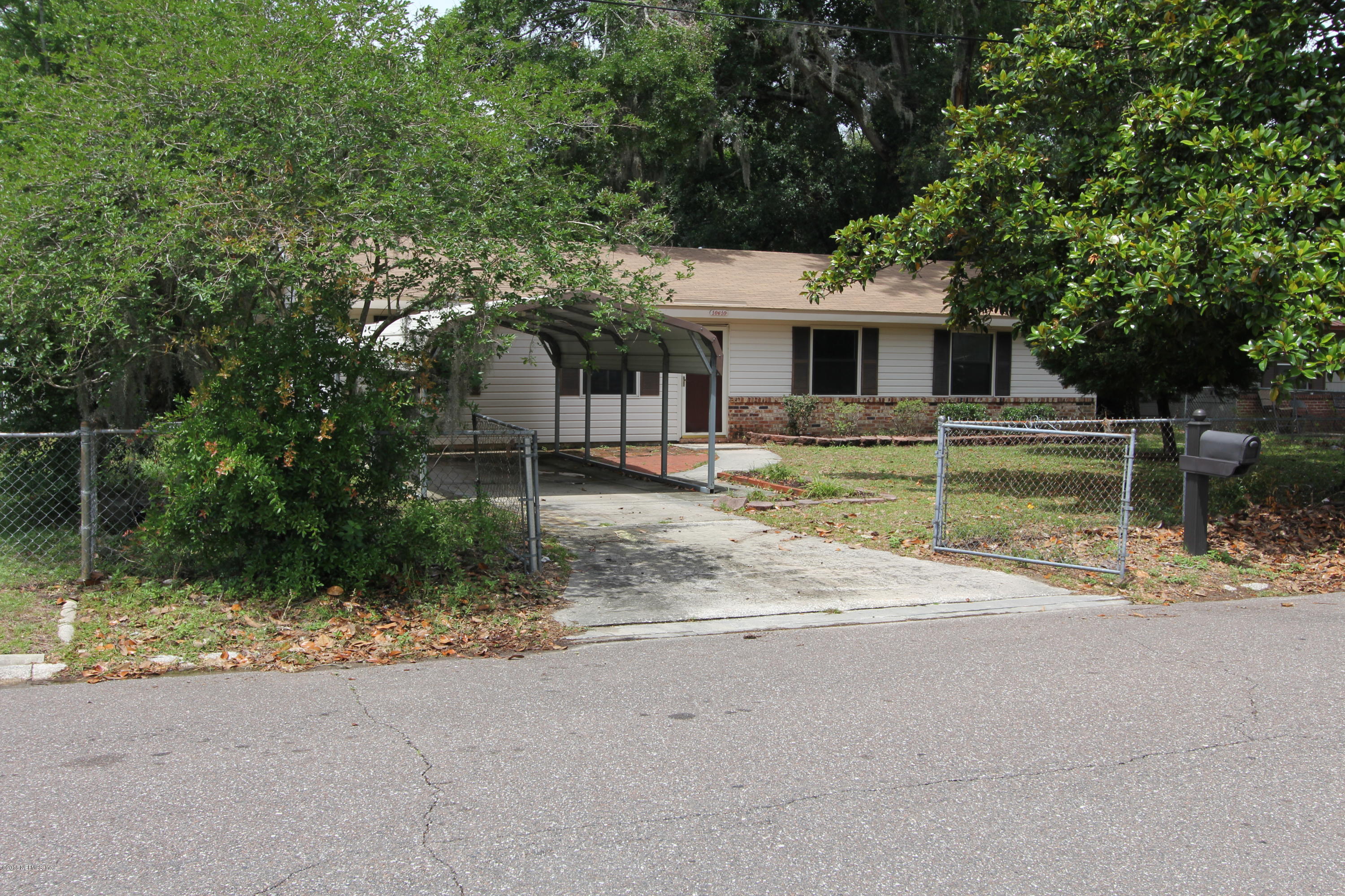 10610 Dodd Road Jacksonville, FL 32218 - Photo 21 of 24 front view of a house with a yard