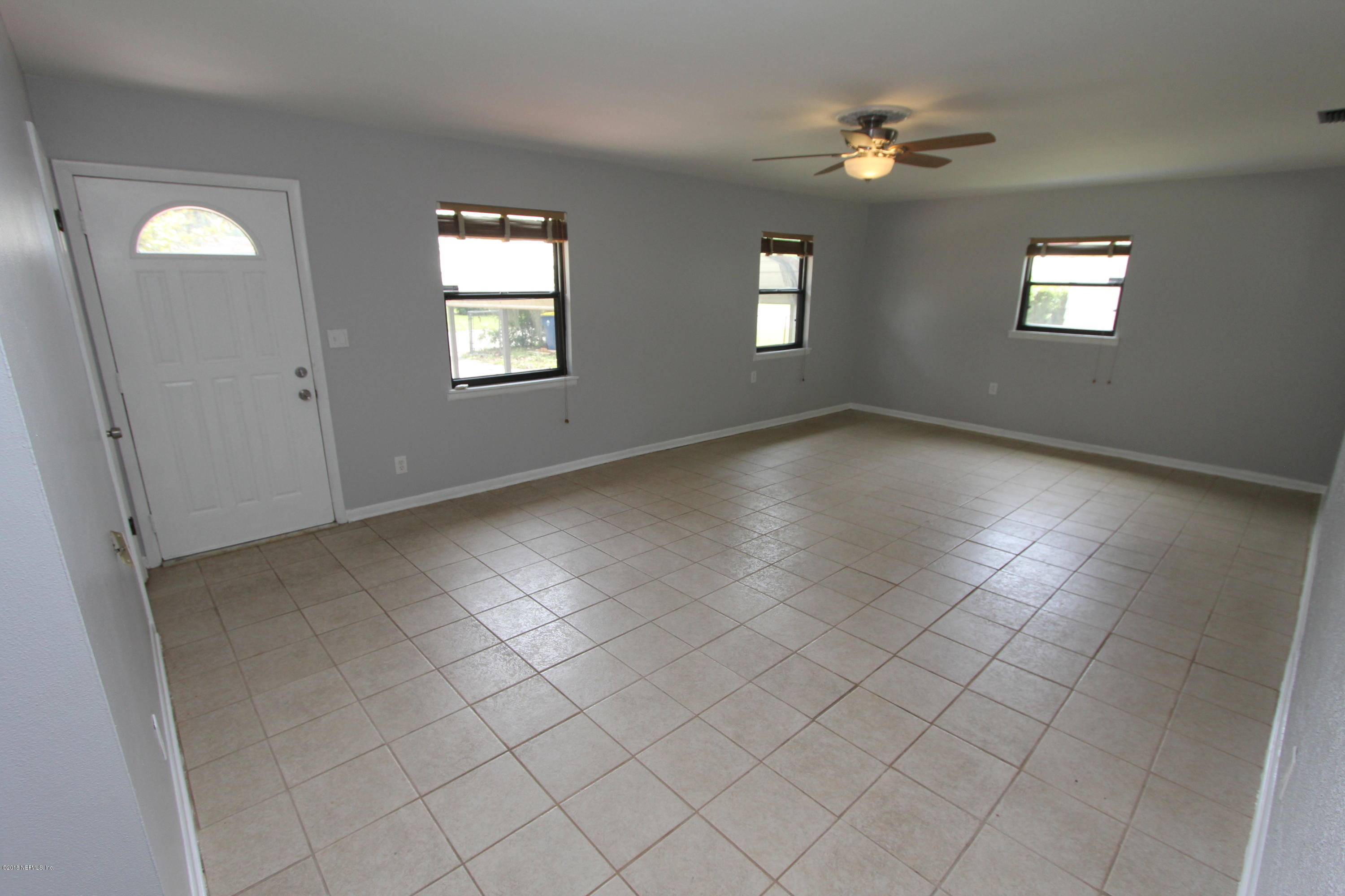 10610 Dodd Road Jacksonville, FL 32218 - Photo 3 of 24 a view of an empty room with windows