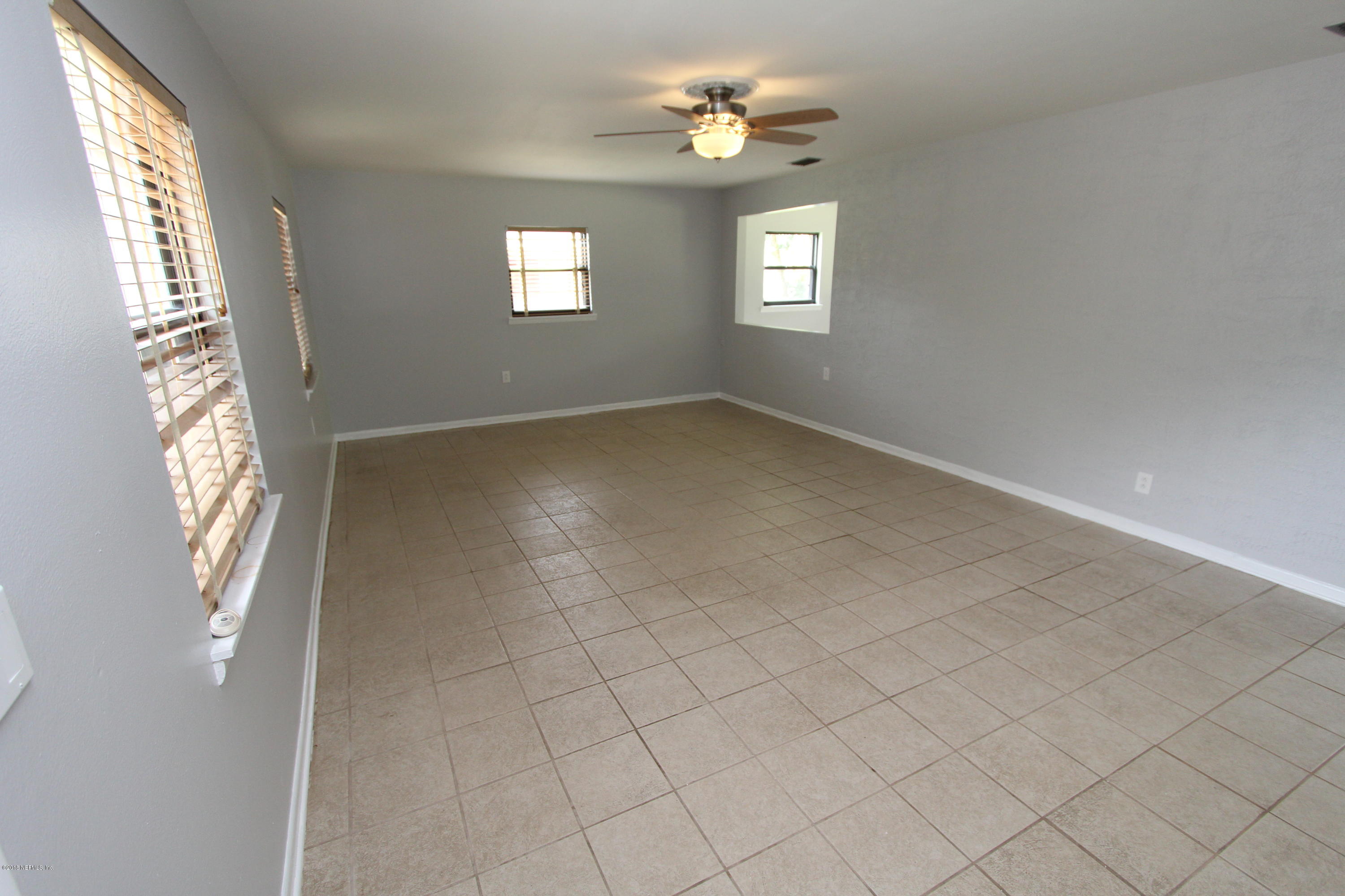 10610 Dodd Road Jacksonville, FL 32218 - Photo 4 of 24 a view of empty room with windows