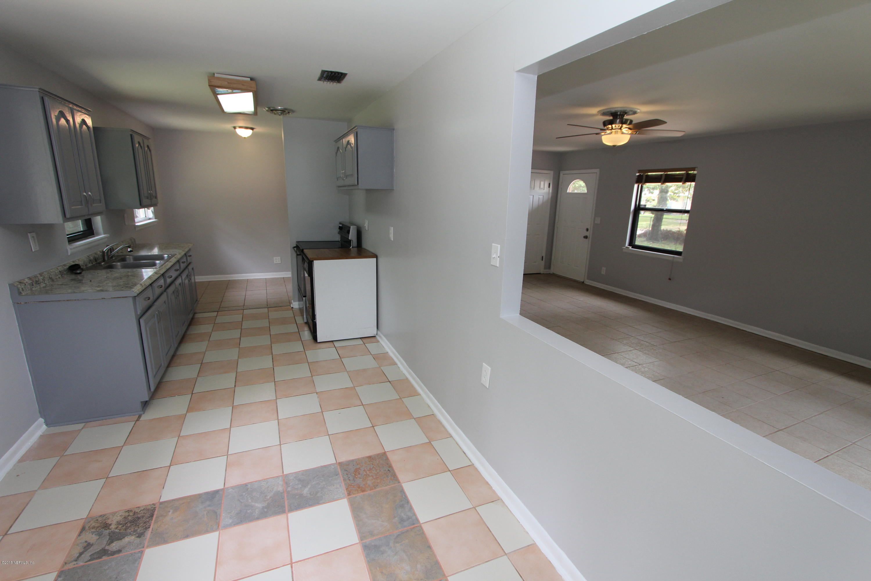 10610 Dodd Road Jacksonville, FL 32218 - Photo 8 of 24 a view of a kitchen with a sink