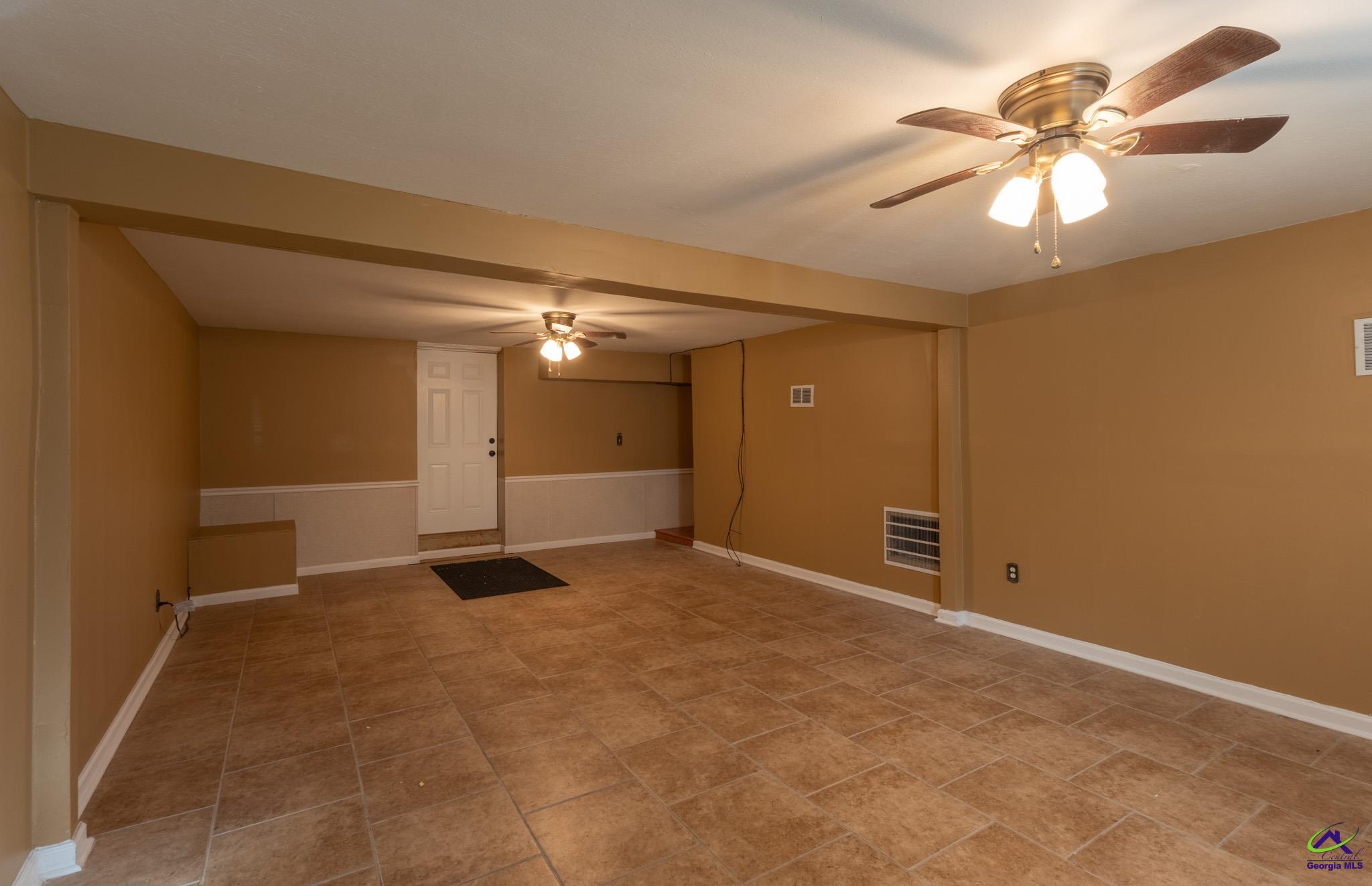 3491 Sandy Circle Macon, GA 31216 - Photo 20 of 47 a view of an empty room with a chandelier fan