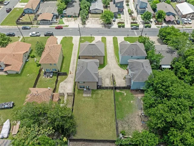 an aerial view of a house with outdoor space