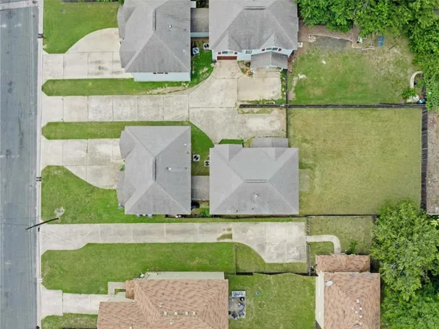 an aerial view of a swimming pool and outdoor space
