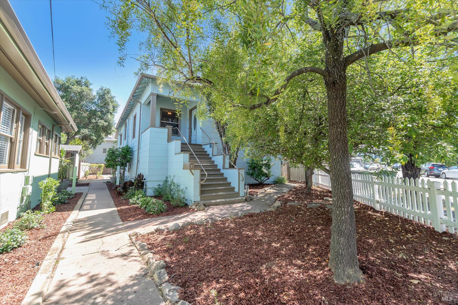 7 Bayview Street San Rafael, CA 94901 - Photo 1 of 79 a view of a house with a tree in the background