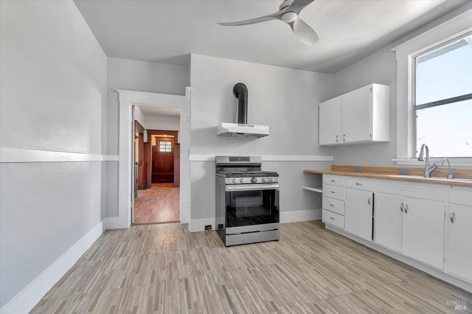 7 Bayview Street San Rafael, CA 94901 - Photo 16 of 79 a kitchen with stainless steel appliances granite countertop a stove and a refrigerator