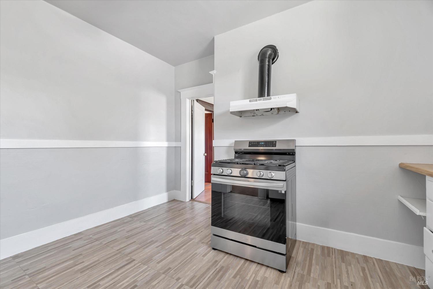7 Bayview Street San Rafael, CA 94901 - Photo 18 of 79 a kitchen with a stove and a refrigerator