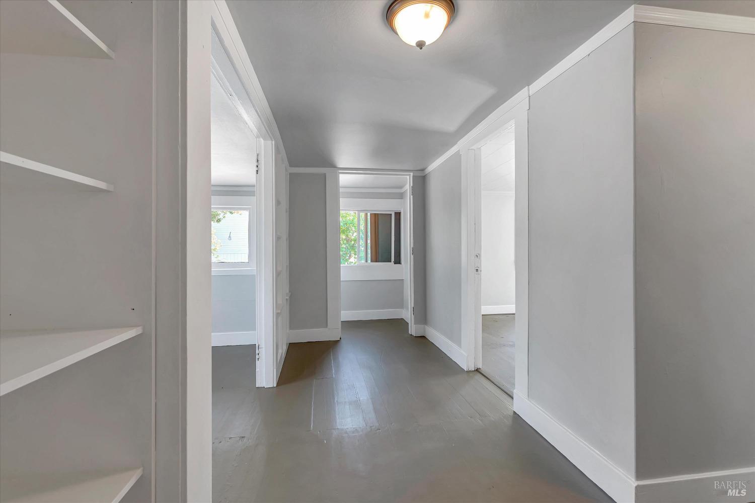 7 Bayview Street San Rafael, CA 94901 - Photo 22 of 79 a view of a hallway with wooden floor and a bathroom