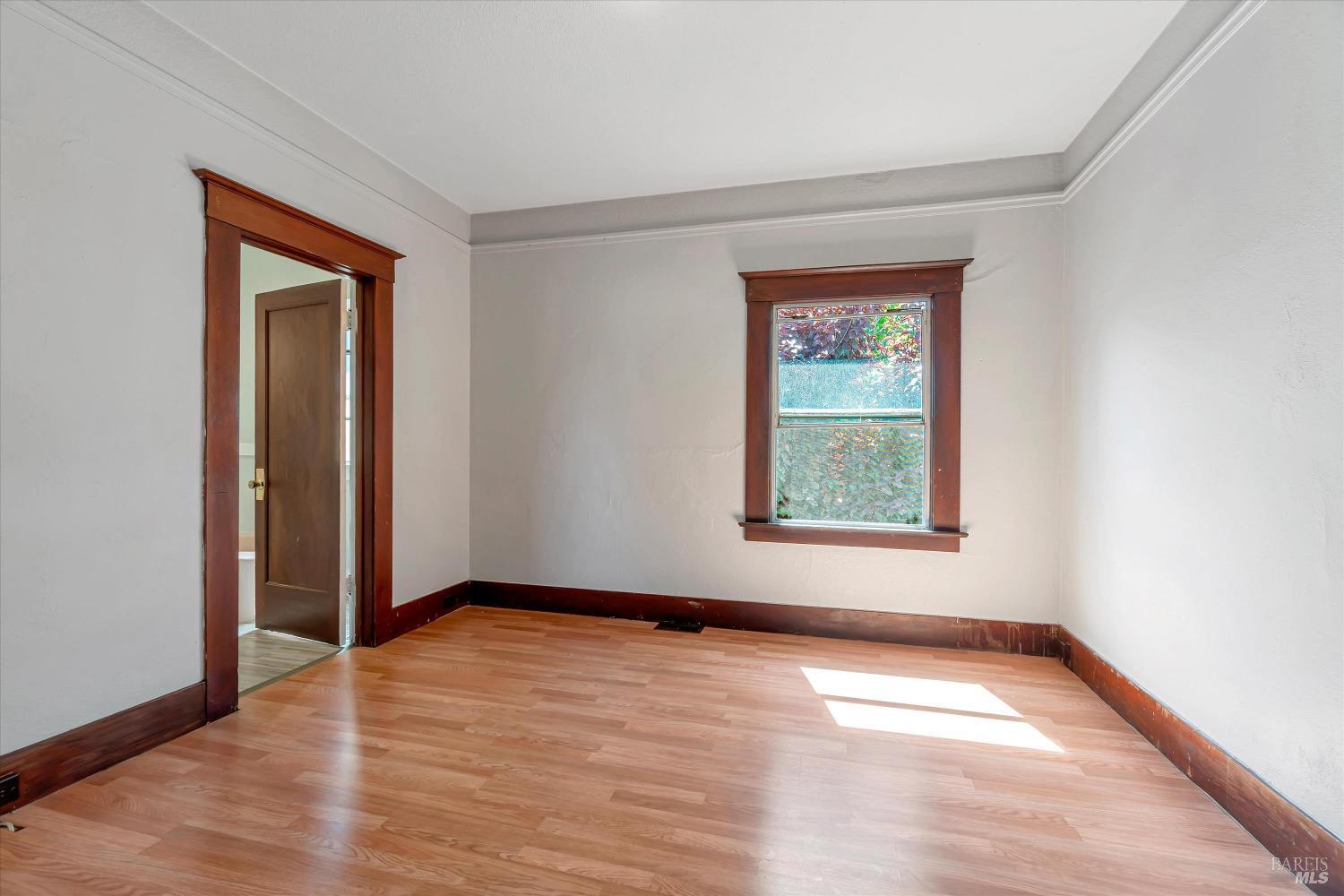 7 Bayview Street San Rafael, CA 94901 - Photo 24 of 79 an empty room with wooden floor and windows