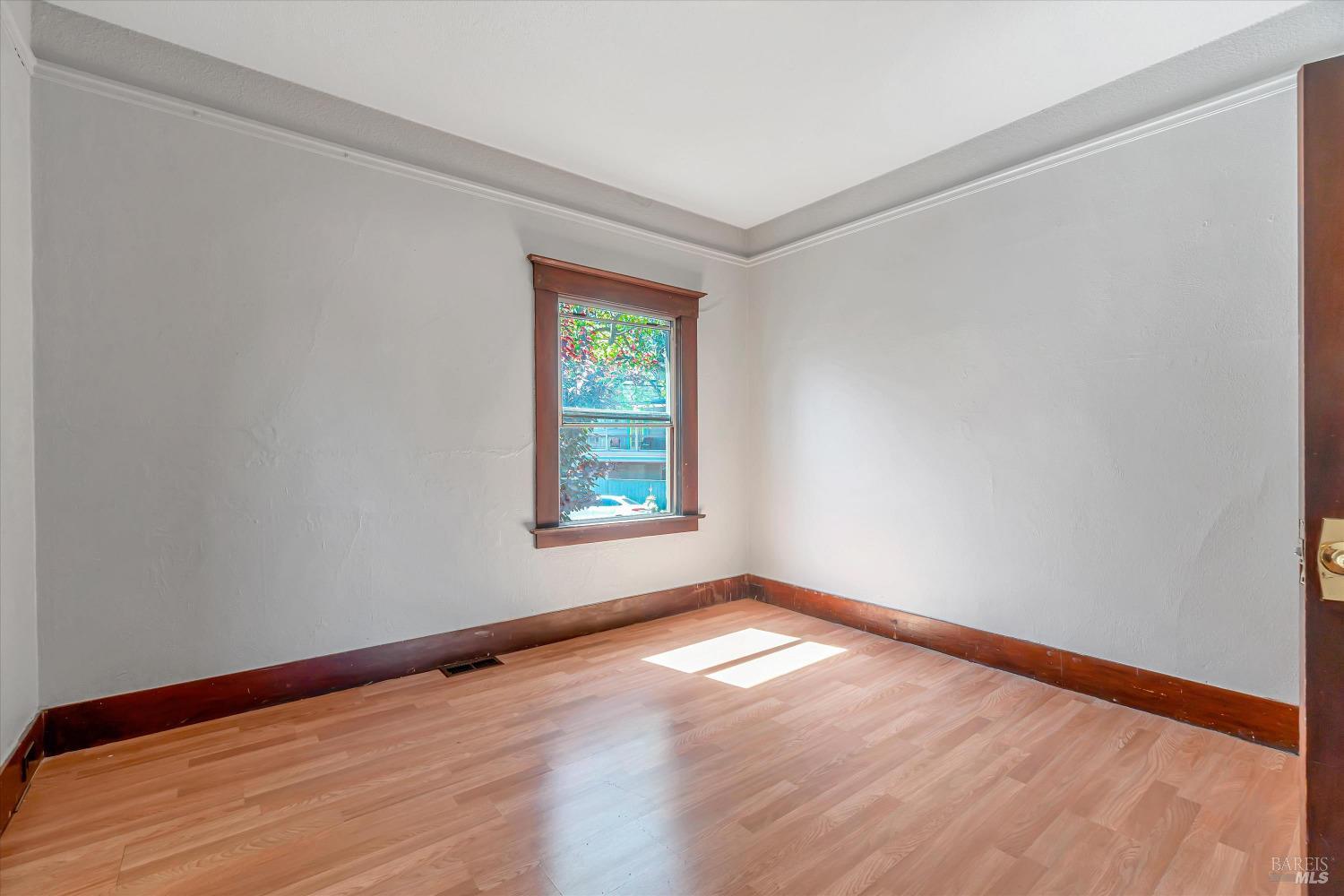 7 Bayview Street San Rafael, CA 94901 - Photo 26 of 79 an empty room with wooden floor and windows