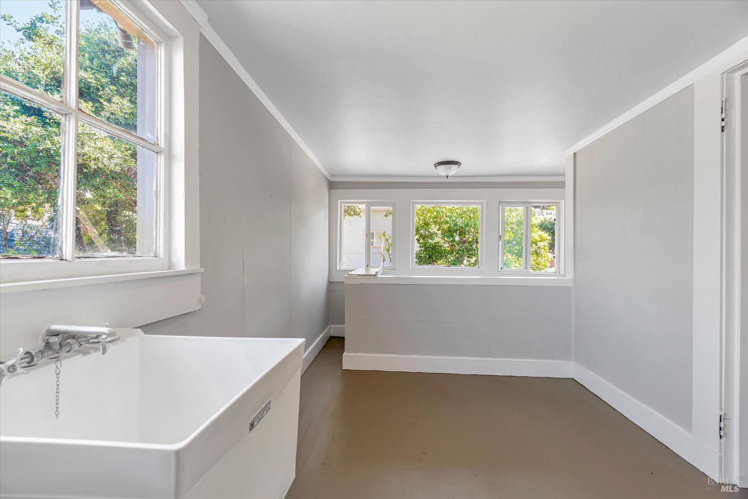 7 Bayview Street San Rafael, CA 94901 - Photo 31 of 79 a bathroom with a bathtub and window