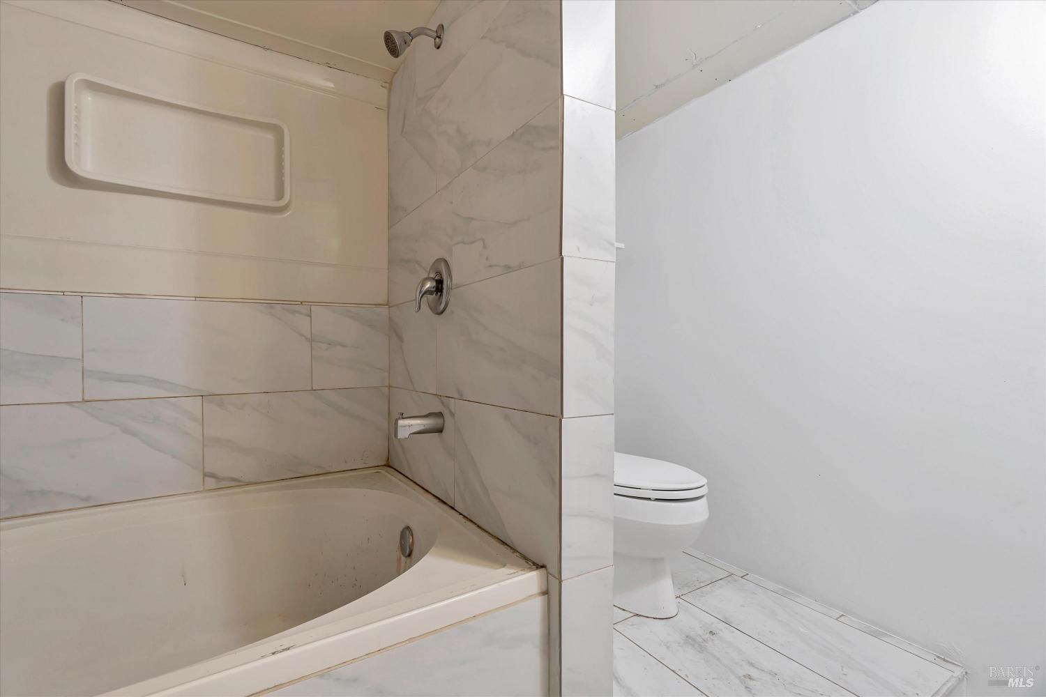 7 Bayview Street San Rafael, CA 94901 - Photo 43 of 79 a bathroom with a toilet and a shower