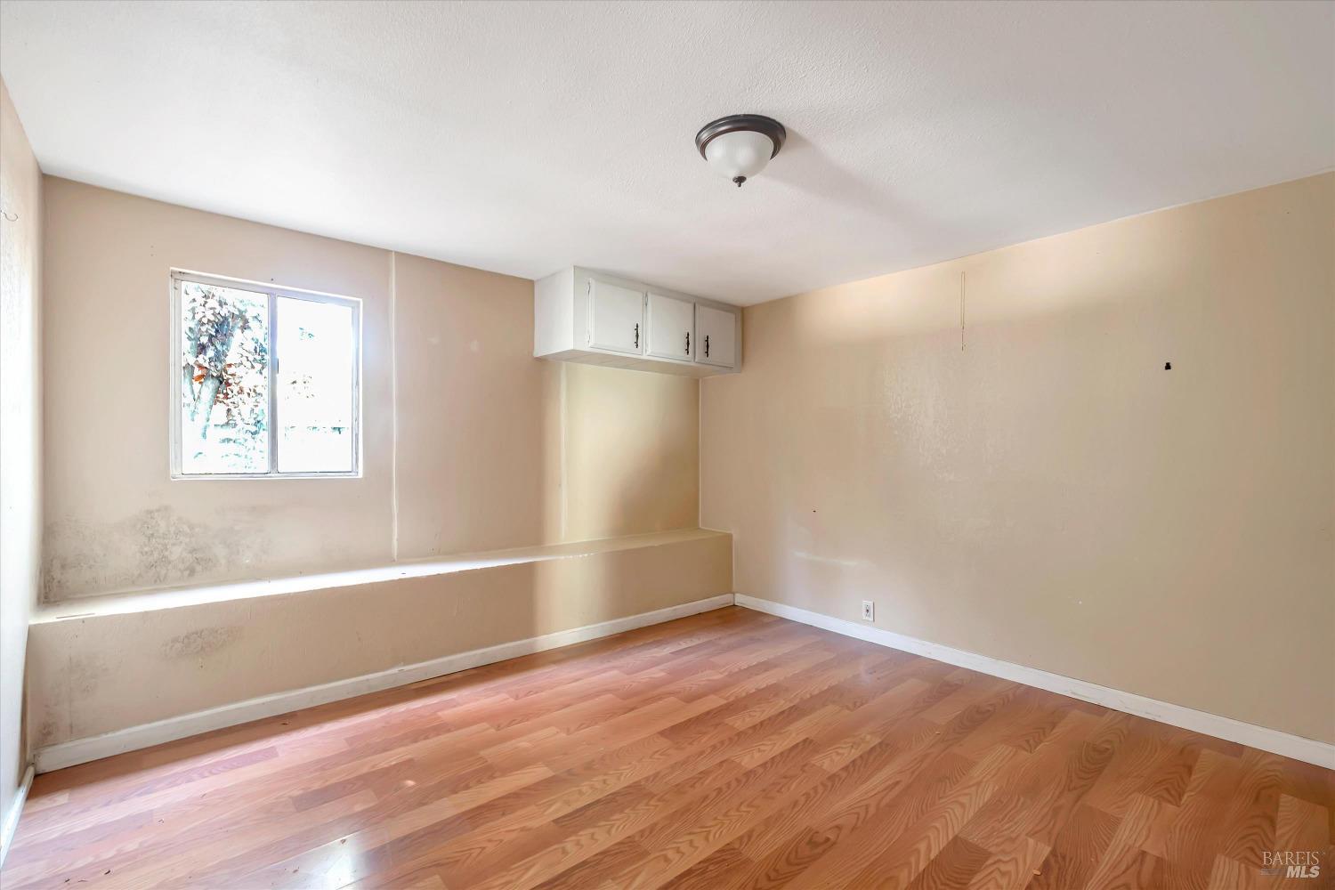 7 Bayview Street San Rafael, CA 94901 - Photo 45 of 79 a view of empty room with wooden floor and fan