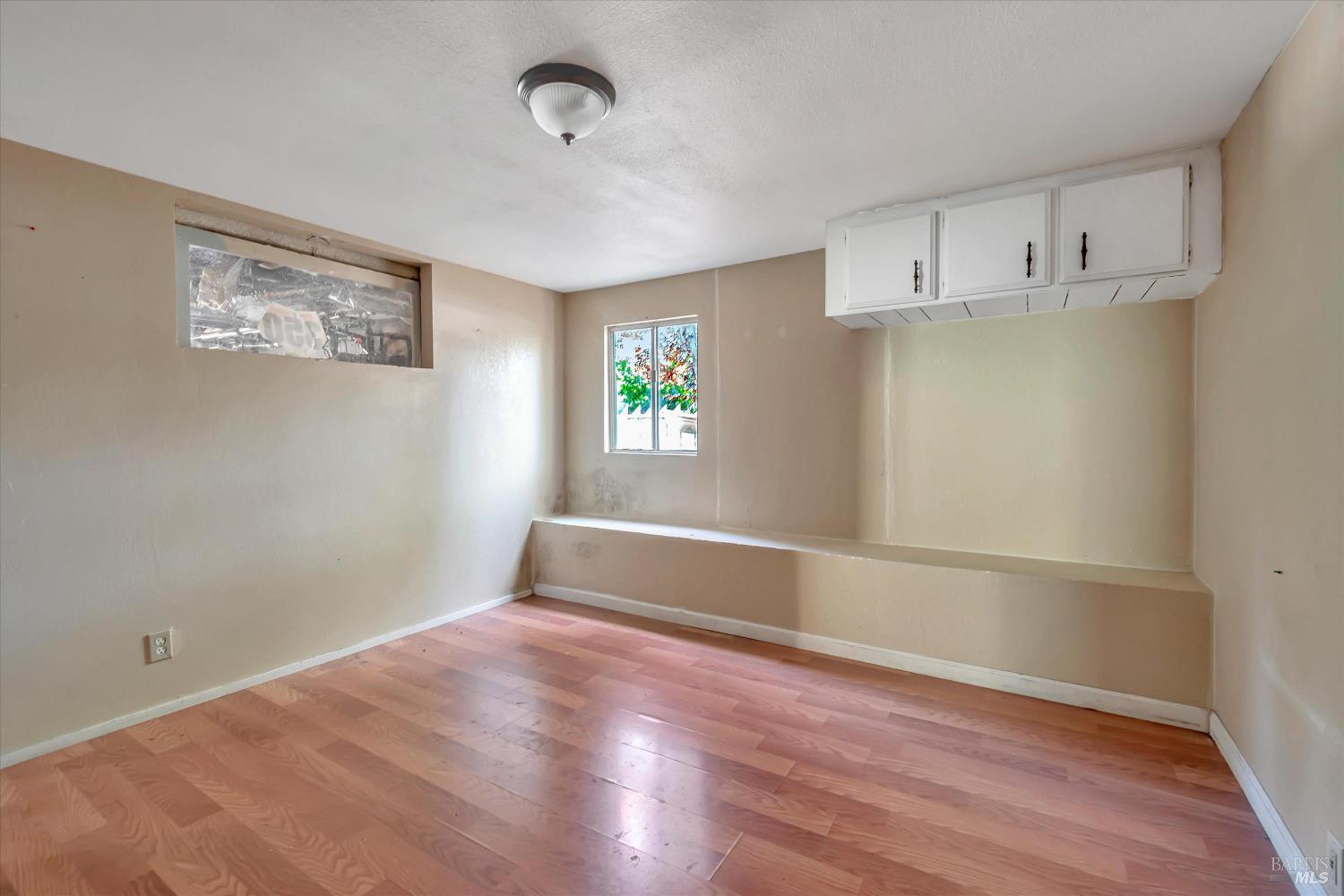 7 Bayview Street San Rafael, CA 94901 - Photo 46 of 79 a view of empty room with wooden floor and fan