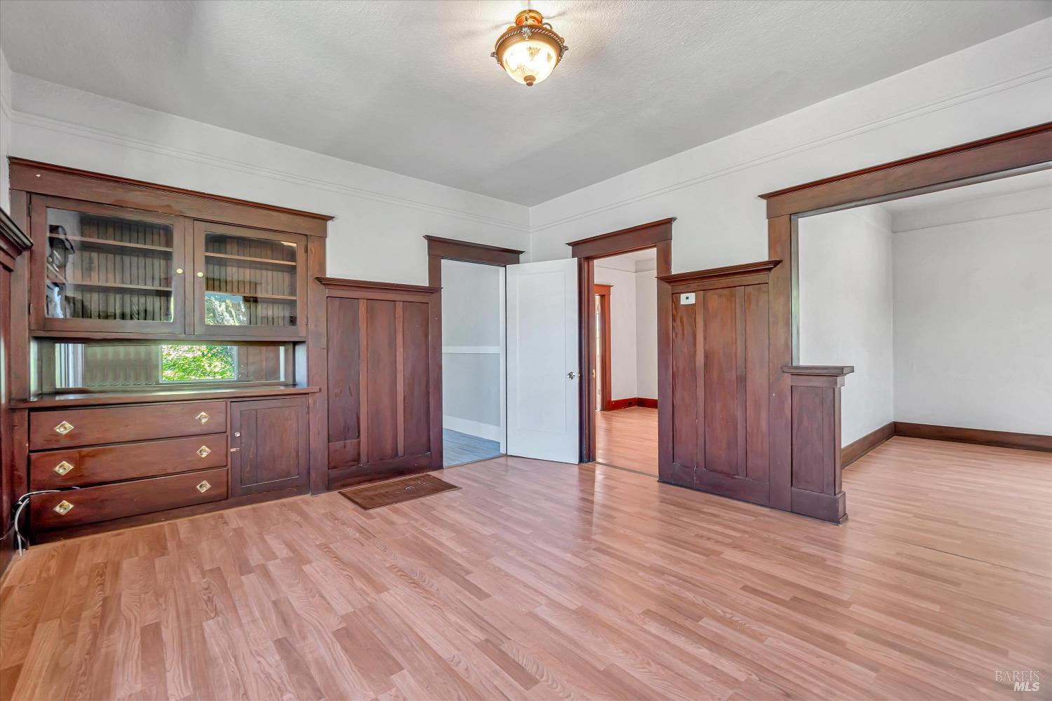 7 Bayview Street San Rafael, CA 94901 - Photo 9 of 79 a view of an empty room with wooden floor and cabinet