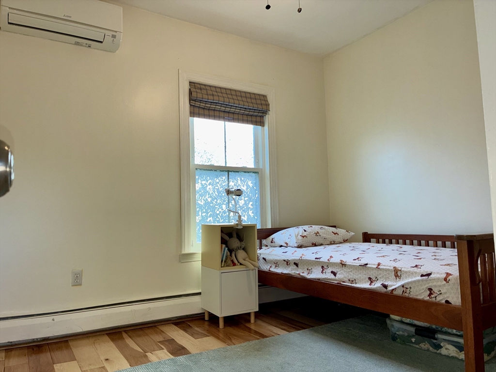 314 Amory Street, Unit 3 Boston, MA 02130 - Photo 15 of 19 a bedroom with a bed and a window