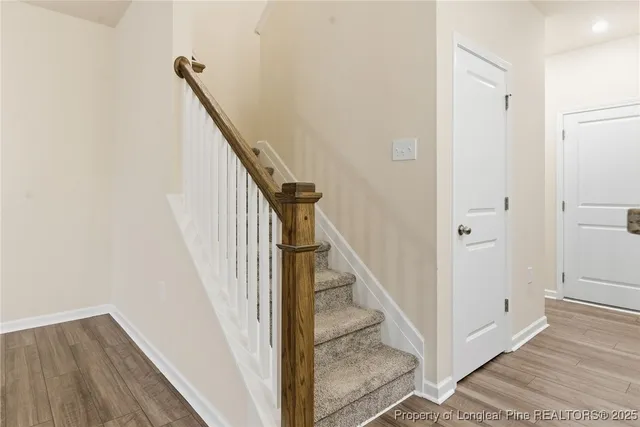 a view of a hallway with closet and entryway