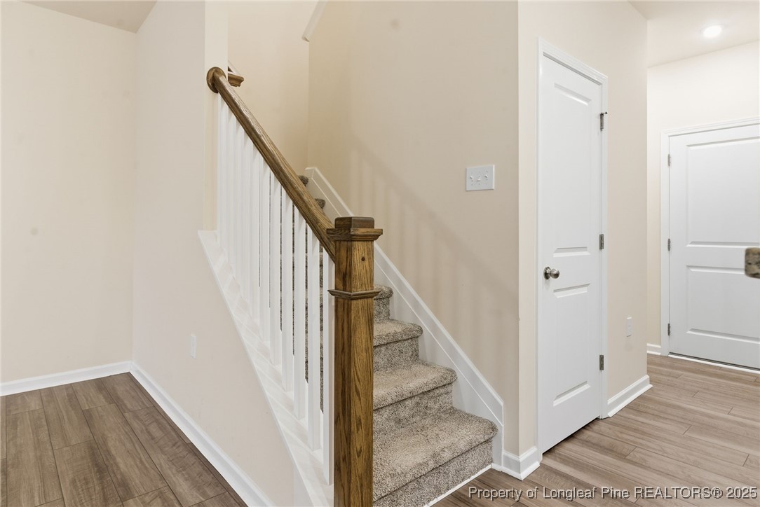 245 Ribbon Rail Street Fuquay-Varina, NC 27526 - Photo 23 of 43 a view of a hallway with staircase