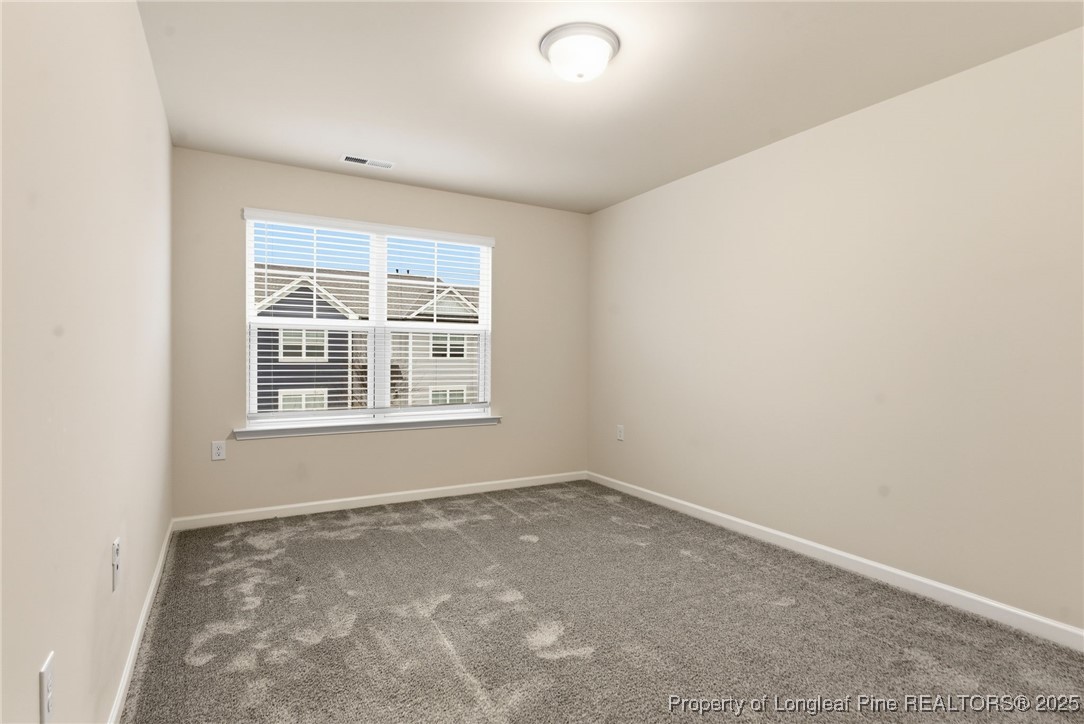 245 Ribbon Rail Street Fuquay-Varina, NC 27526 - Photo 25 of 43 an empty room with a window