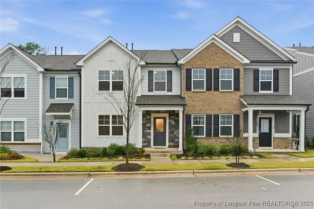 a front view of a residential houses with street