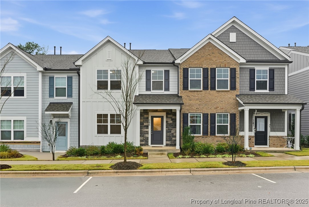 245 Ribbon Rail Street Fuquay-Varina, NC 27526 - Photo 3 of 43 a front view of a residential houses with street