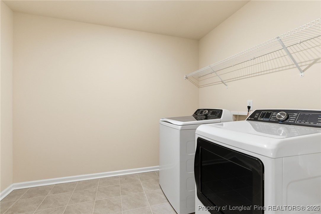 245 Ribbon Rail Street Fuquay-Varina, NC 27526 - Photo 31 of 43 a utility room with dryer and washer