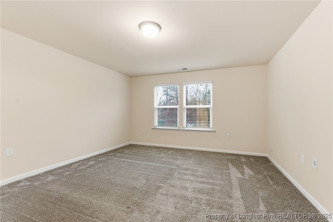 245 Ribbon Rail Street Fuquay-Varina, NC 27526 - Photo 34 of 43 an empty room with a window