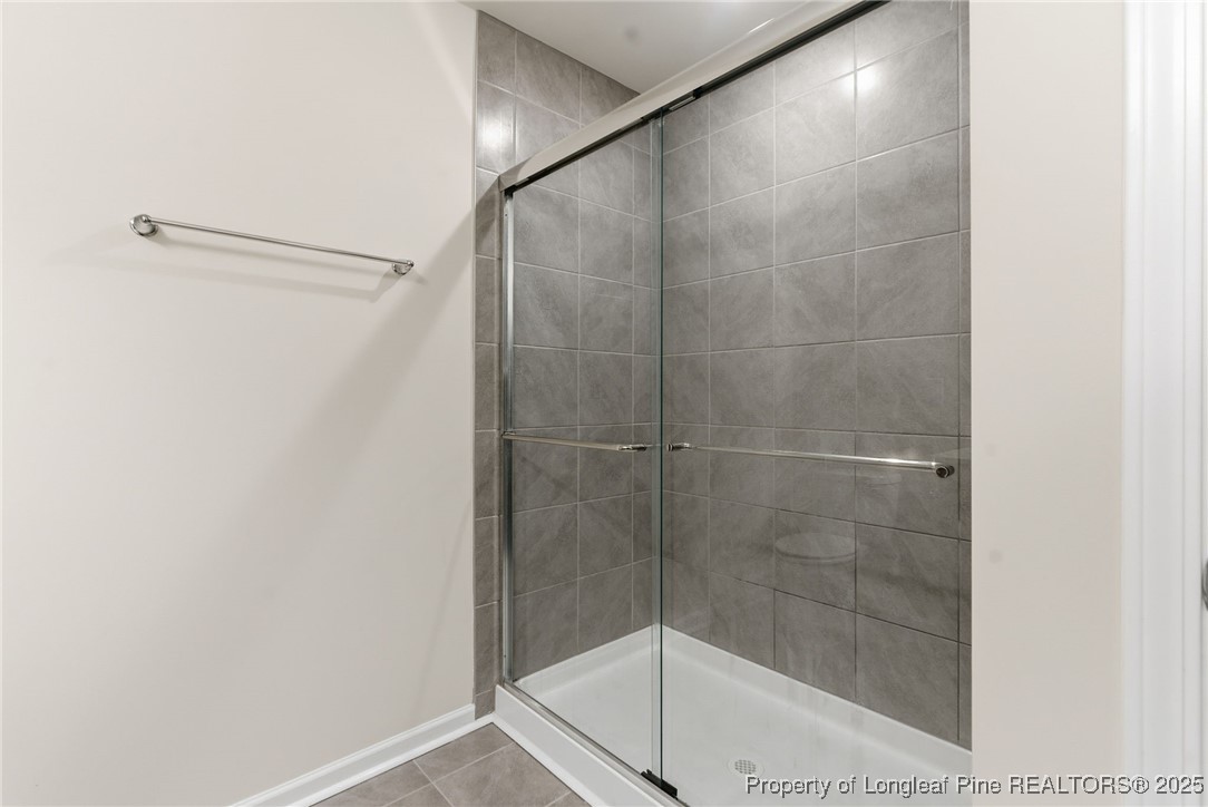 245 Ribbon Rail Street Fuquay-Varina, NC 27526 - Photo 40 of 43 a bathroom with a shower