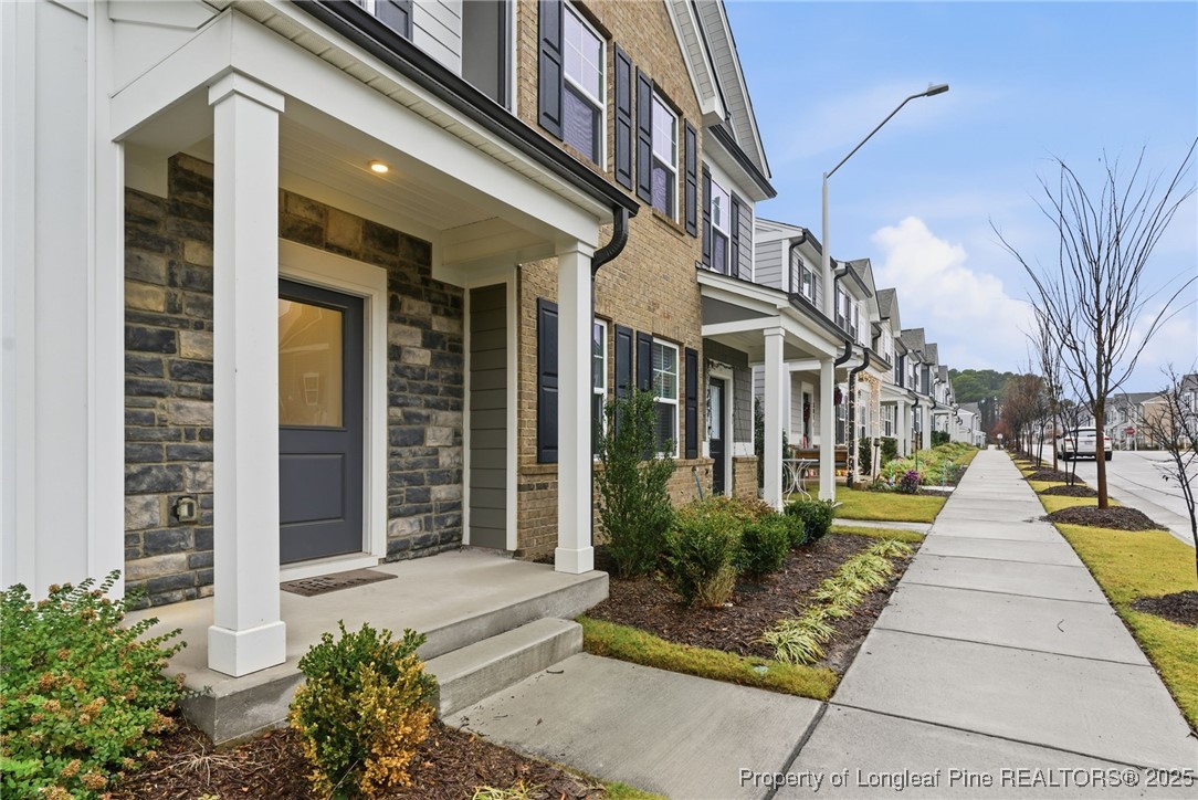 245 Ribbon Rail Street Fuquay-Varina, NC 27526 - Photo 4 of 43 a front view of a building