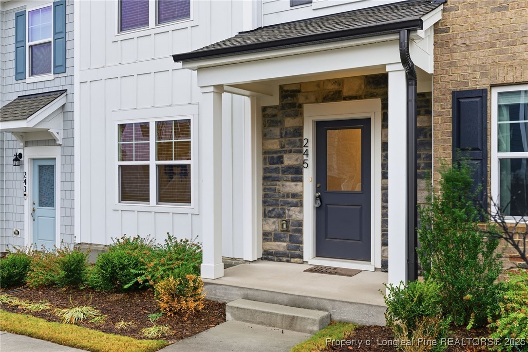 245 Ribbon Rail Street Fuquay-Varina, NC 27526 - Photo 5 of 43 a front view of a house with plants