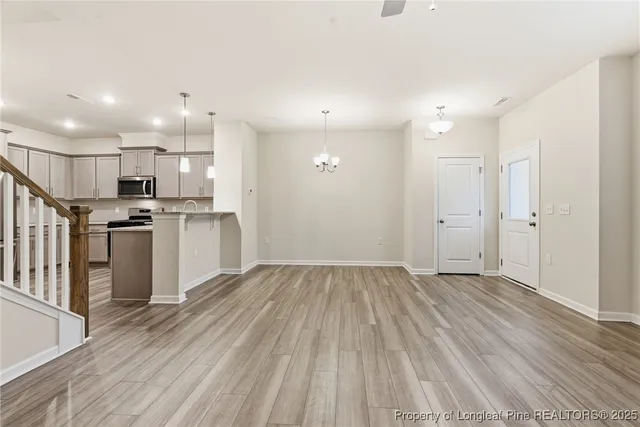 a view of a kitchen with wooden floor