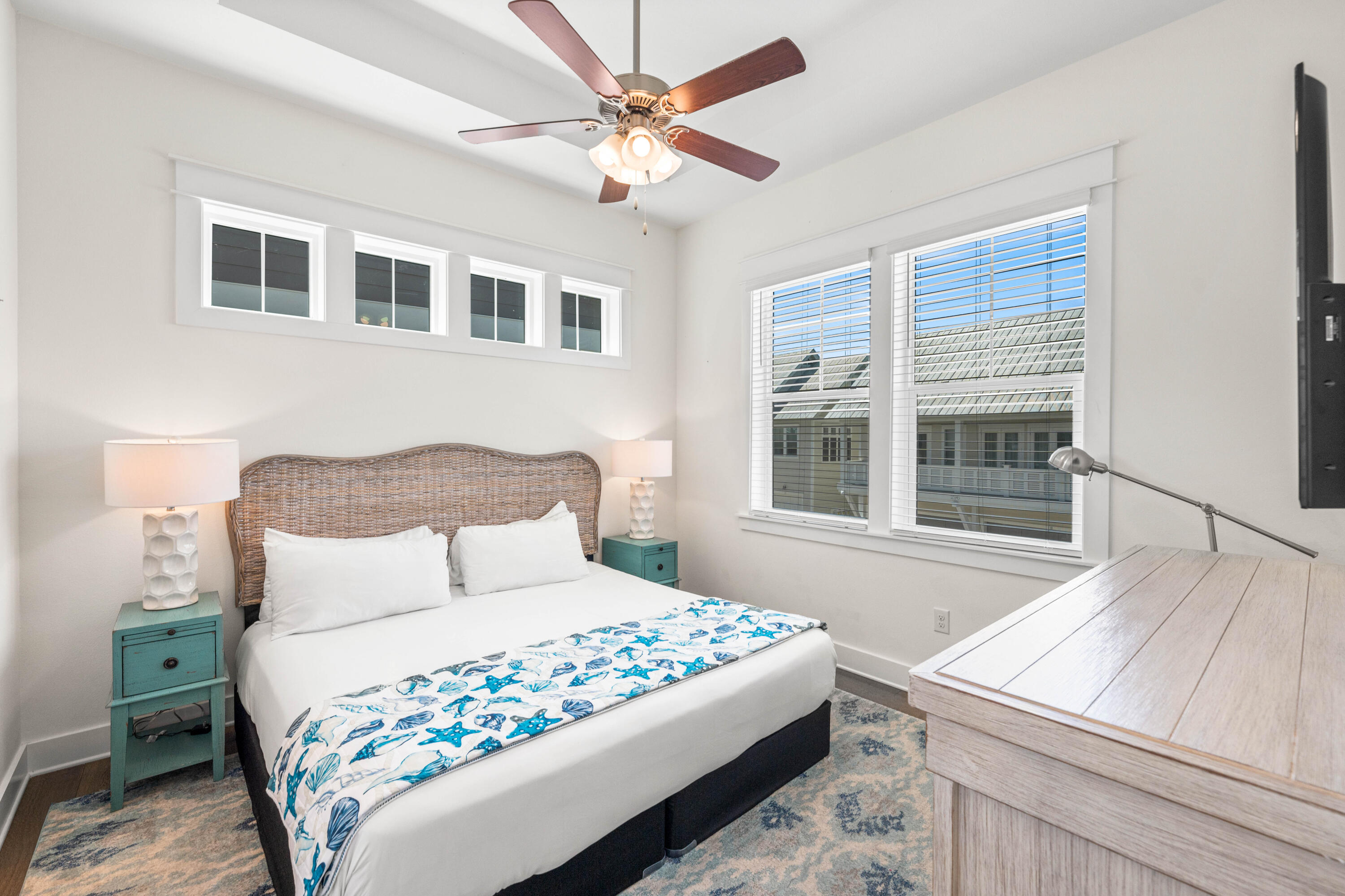 289 Milestone Dr Inlet Beach, Unit C Inlet Beach, FL 32461 - Photo 16 of 59 a bedroom with a large bed and a window