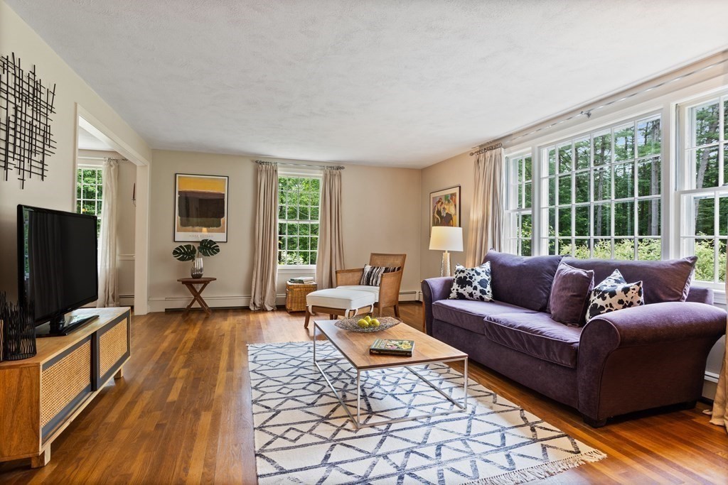 86 Pine Hill Road Boxborough, MA 01719 - Photo 11 of 42 a living room with furniture and a flat screen tv