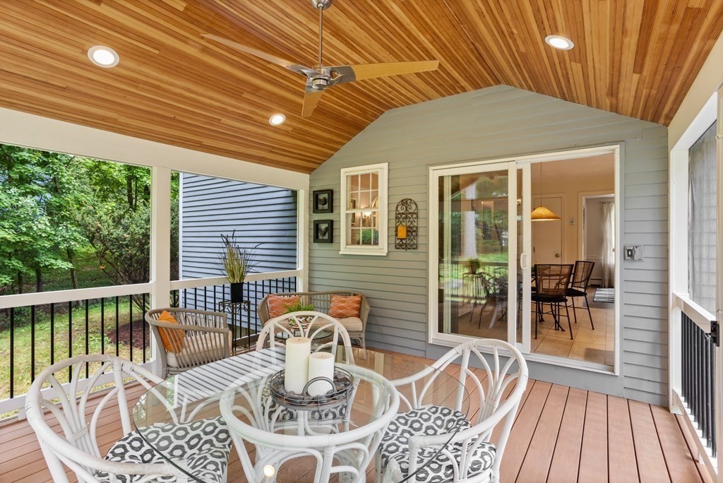 86 Pine Hill Road Boxborough, MA 01719 - Photo 13 of 42 a view of a patio with a dining table and chairs