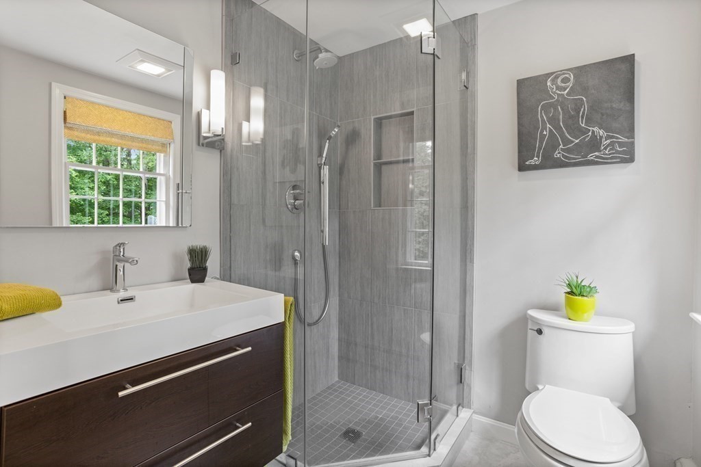 86 Pine Hill Road Boxborough, MA 01719 - Photo 21 of 42 a bathroom with a sink a toilet and shower