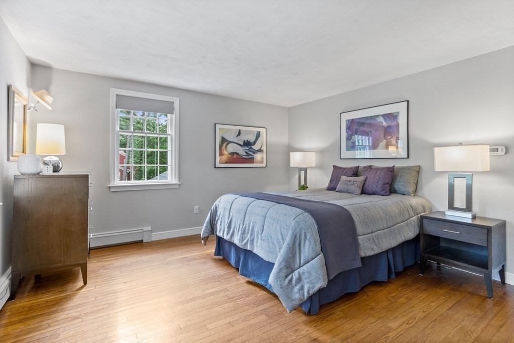 86 Pine Hill Road Boxborough, MA 01719 - Photo 22 of 42 a spacious bedroom with a bed and a window